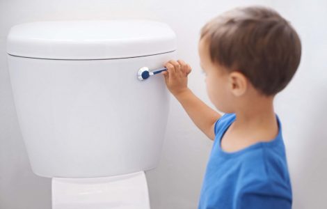 a Child Flushing Toilet